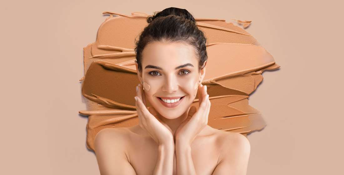 woman applying foundation