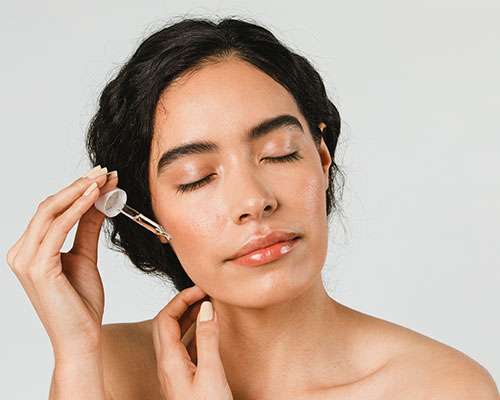 woman applying glycolic acid